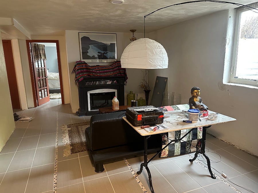 Basement Room with electric fireplace, sitting room or work room with legal egress window