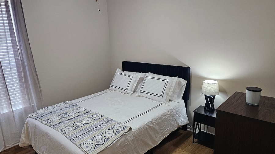 Queen size bed in Bedroom 2 with stand in closet