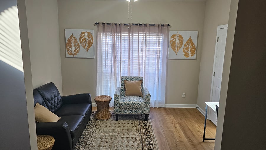 Den with leather loveseat and chair