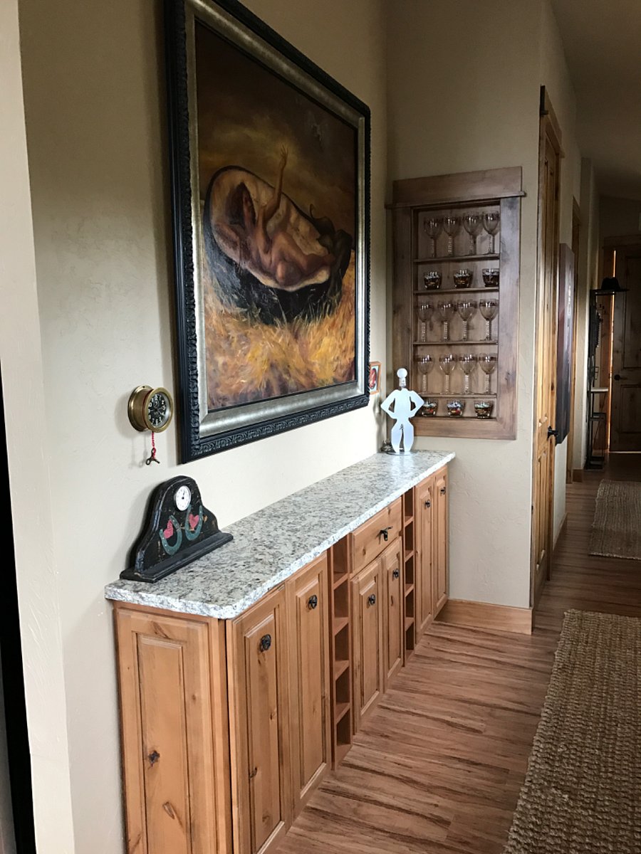 The Bar with built-ins for wine Storage and glassware. The countertop is Granite and the wood is alder. 