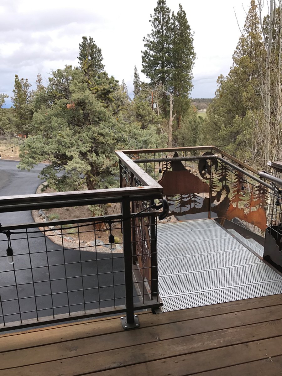 This is the top of the staircase leading to the front door and the view from the deck