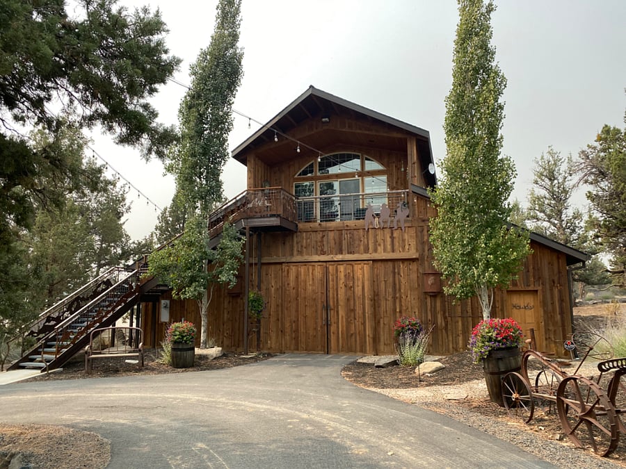 Photograph of the Miracle barn with the stairway to the apartment above