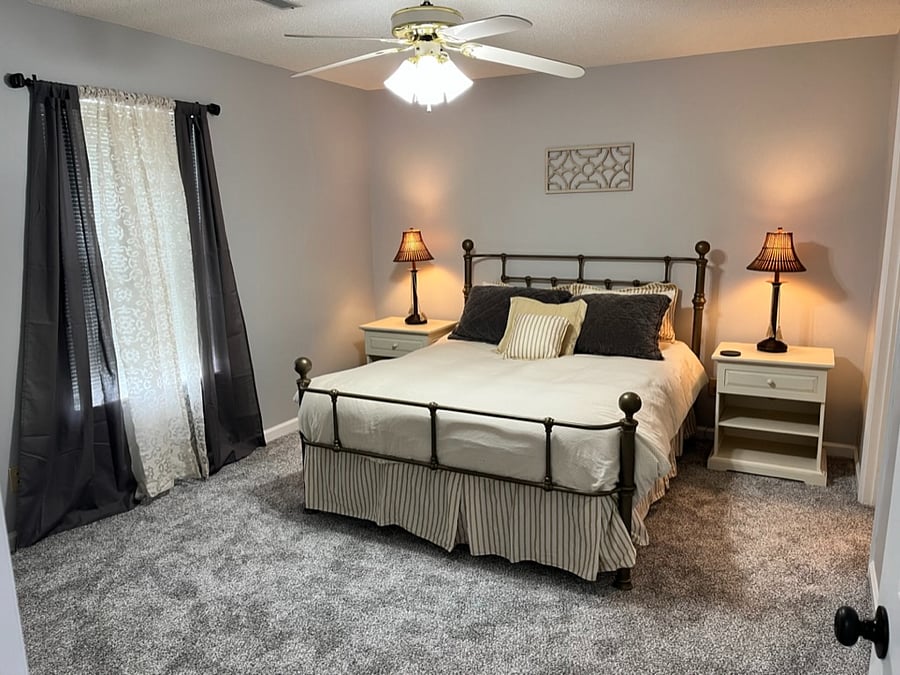 Queen bed on opposite side of residence