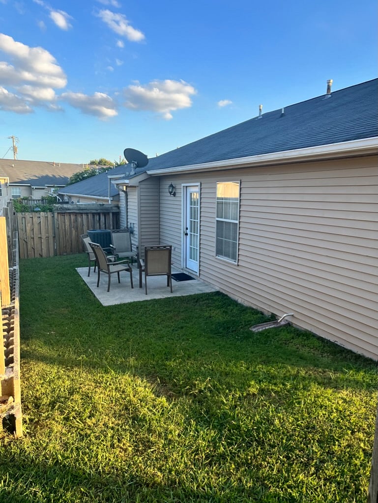 Back patio surrounded by privacy fence