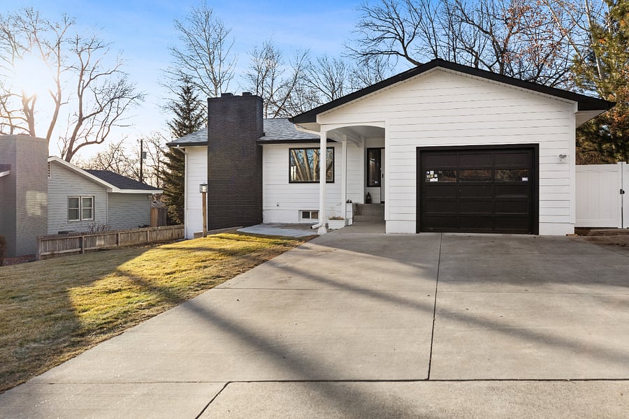 Front of home with parking and garage