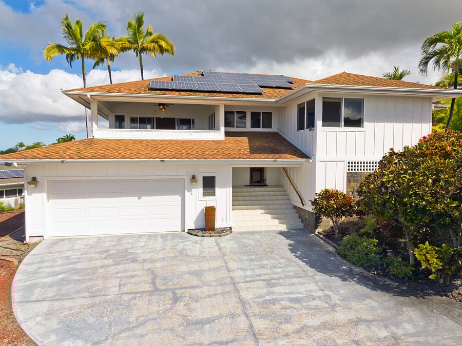 Convenient location with easy access to beaches, downtown, shopping, groceries, farmer's markets, golf, tennis, pickelball courts. View of front entrance. Well maintained home. Outdoor parking is in this area. Note: both outside and inside staircases take you to your beautiful living space.