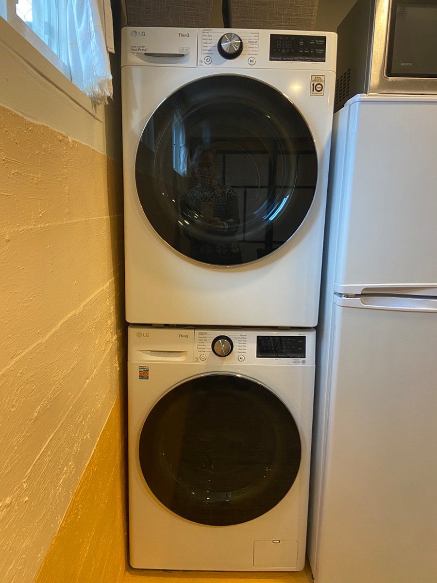 W/D in kitchen (owner accesses 2x/month) & 3/4-sized fridge