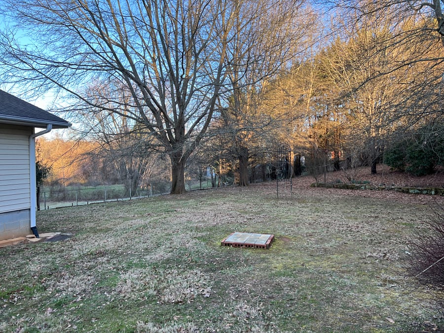 Backyard view from covered patio.