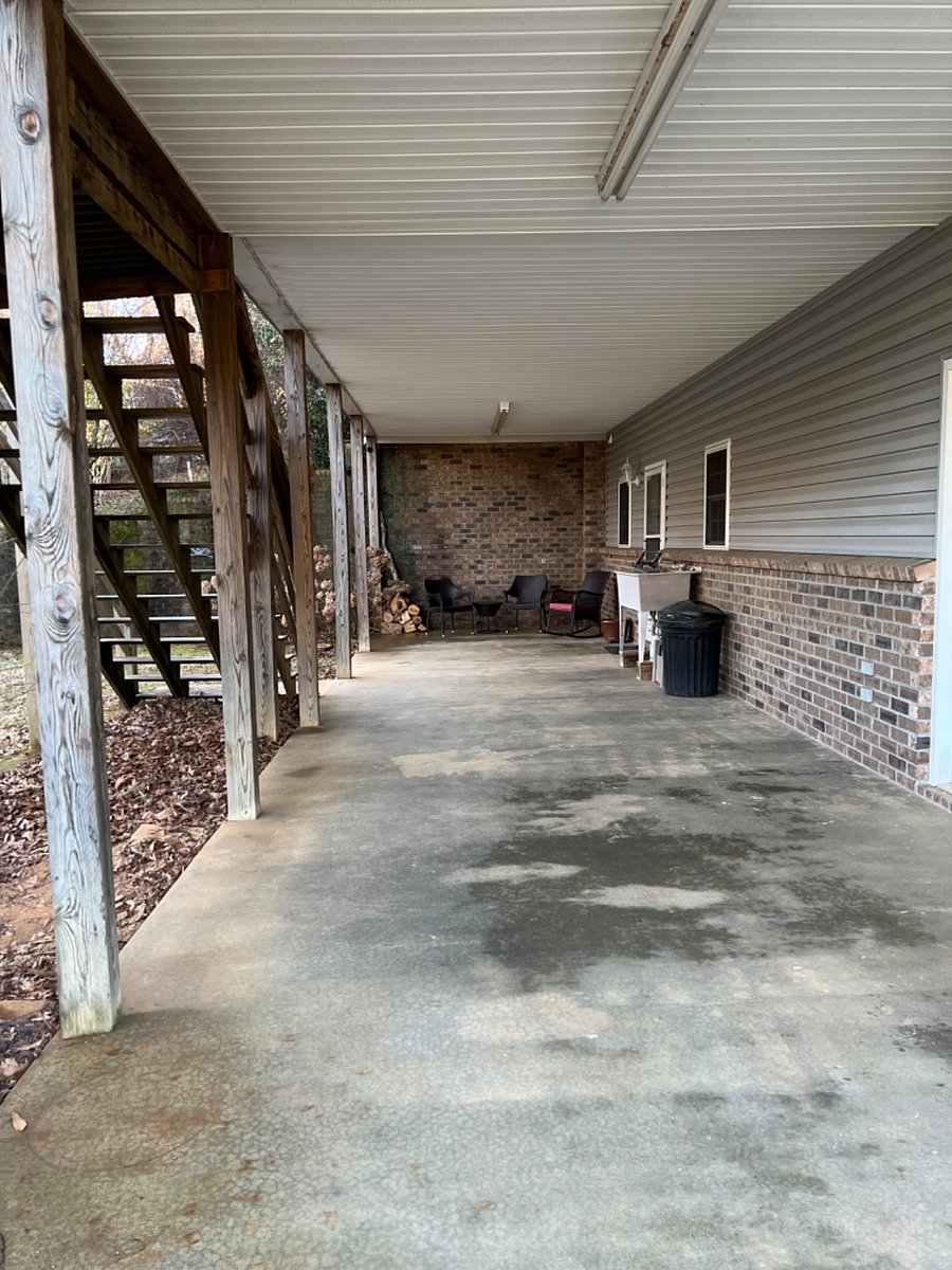 Covered porch entryway to apartment entrance.