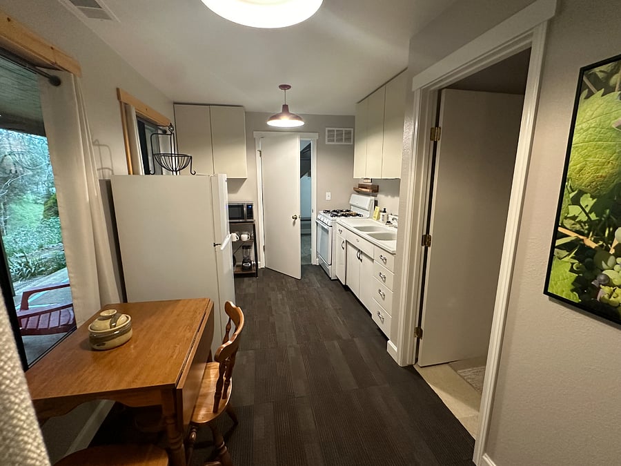 Kitchenette and bathroom entrance.