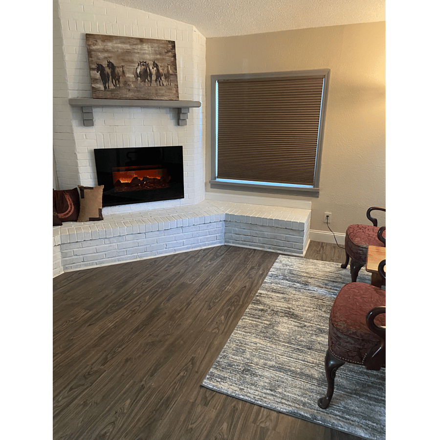 Electric fireplace in the large living room.