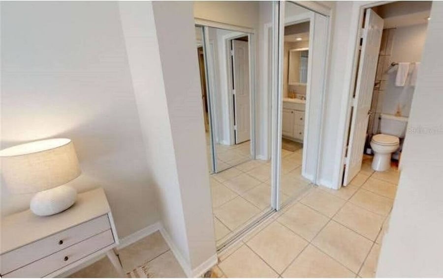 master closet space connecting to the full bath