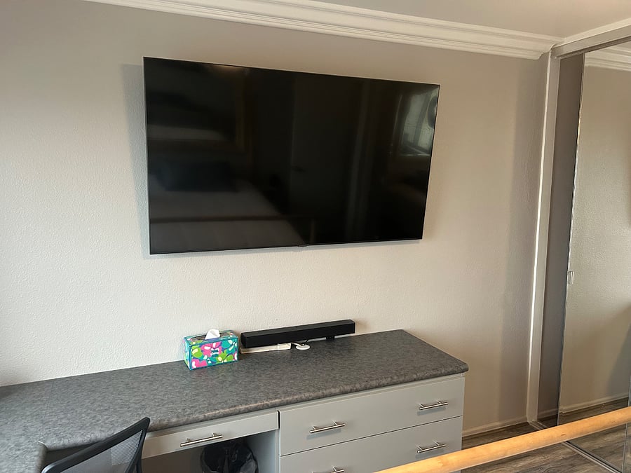 65 inch TV with soundbar.