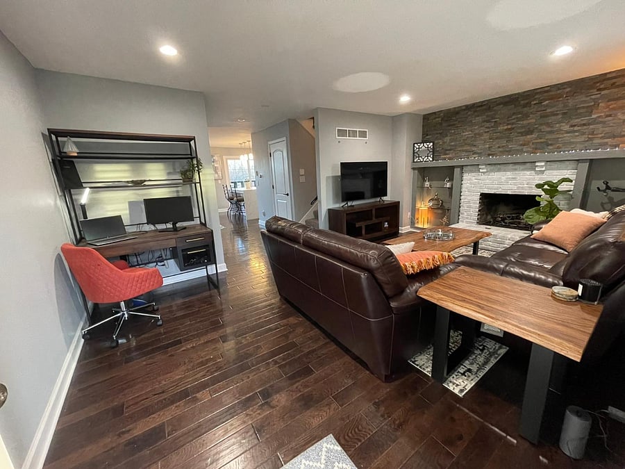 View from front door. Office nook and living room with fire place.  