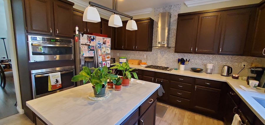 Large kitchen with gas stove top, microwave, refrigerator, toaster oven and convection oven.