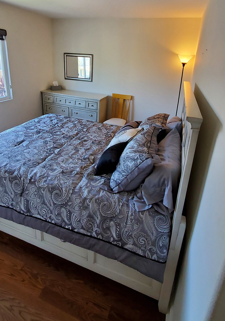 Furnished bedroom includes dresser