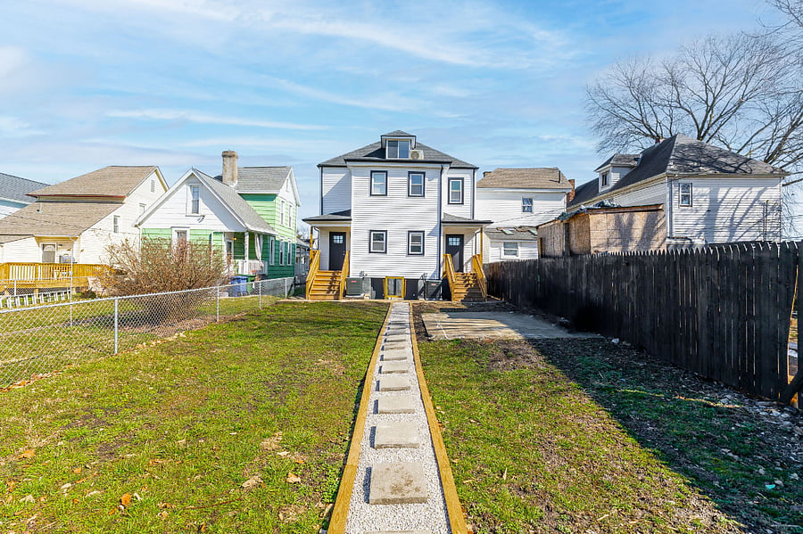 Backyard walkway (from parking pad to property)