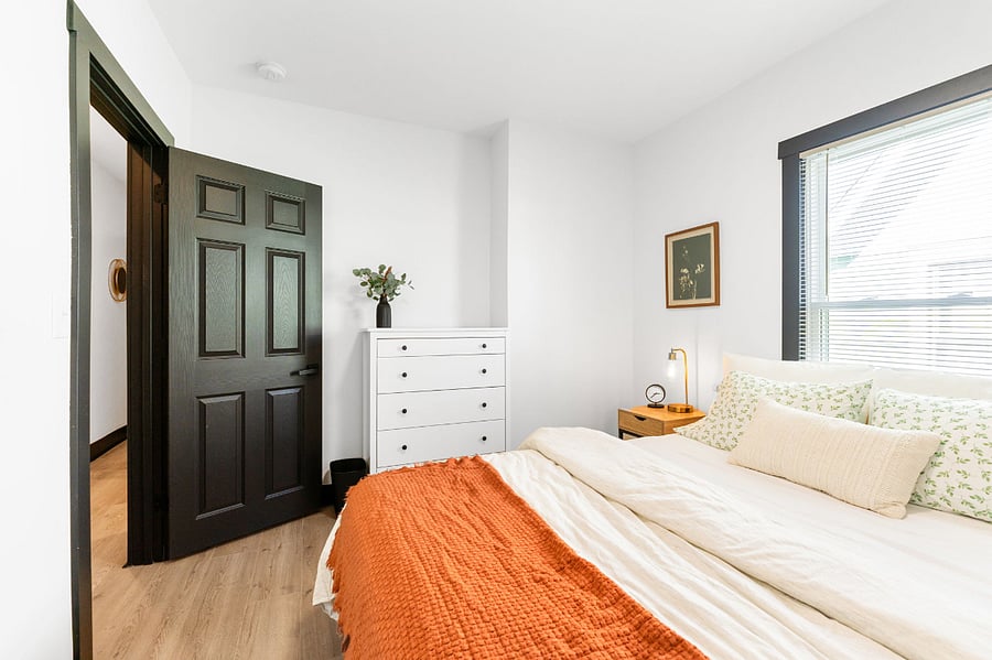 Bedroom 2 includes a cozy queen size bed, closet, touch lamps, dresser, and a smart TV.