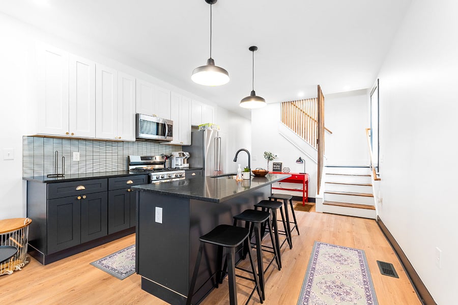 Fully equipped kitchen with new appliances, granite countertops, and slow close cabinets.