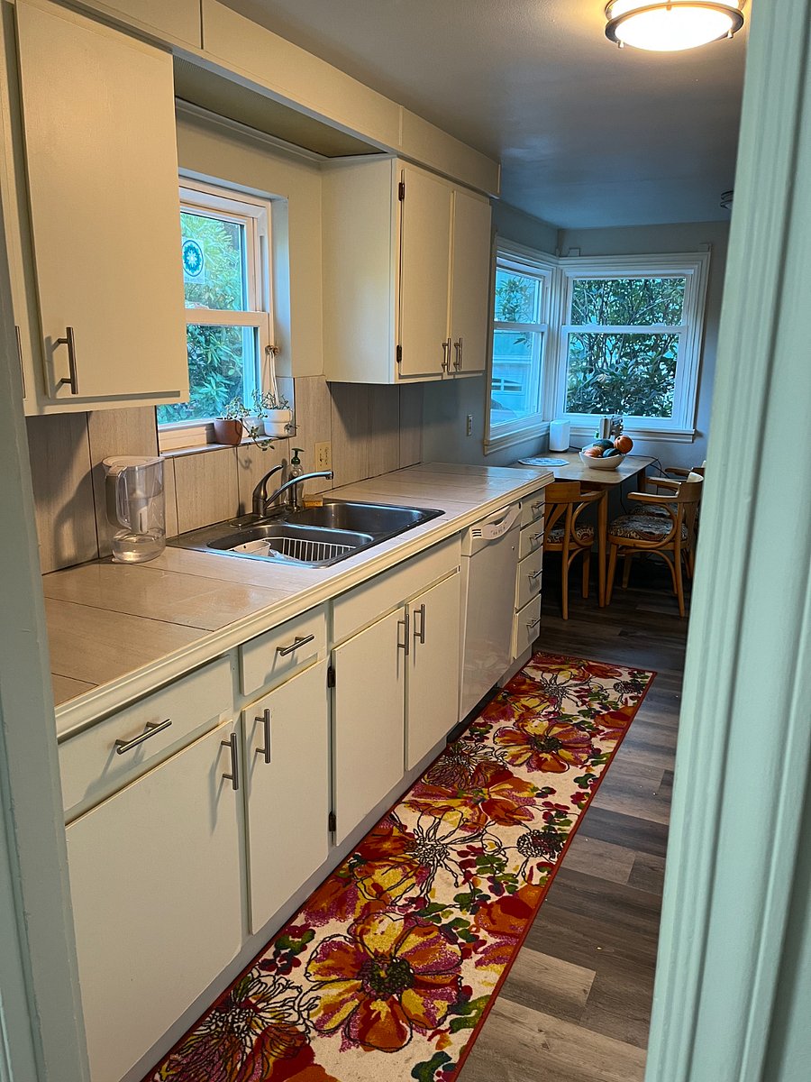 kitchen with gas stove and full refrigerator