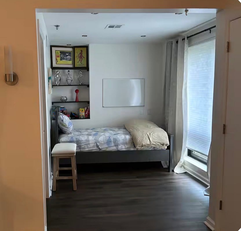 Den with twin bed; note, there is no door to separate from living room