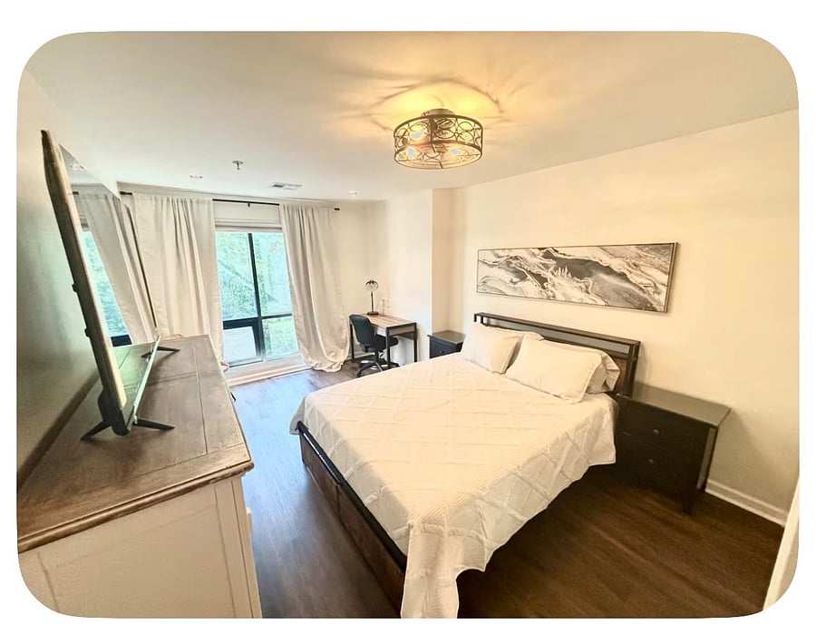 firm queen mattress, linens provided. this room also has a larger white desk (in place of the one pictured)