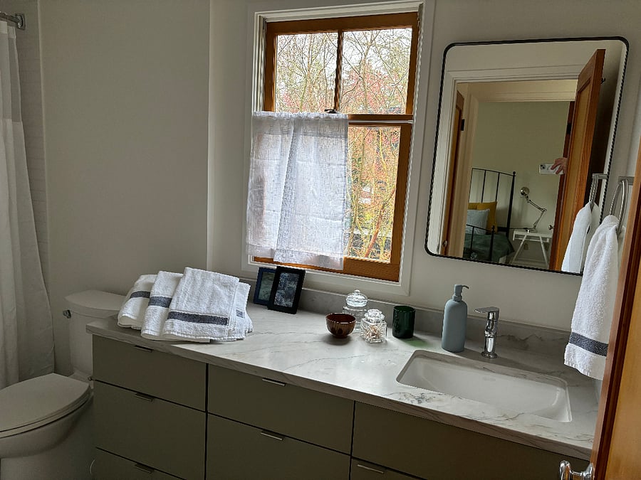 Full bathroom second floor, ample storage here and in hallway linen closet. Across the hall from west facing BR (see mirror reflection).