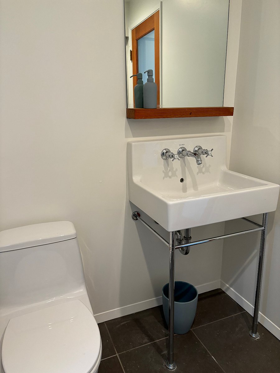 Half bath, first floor. Also includes stacked w/d.