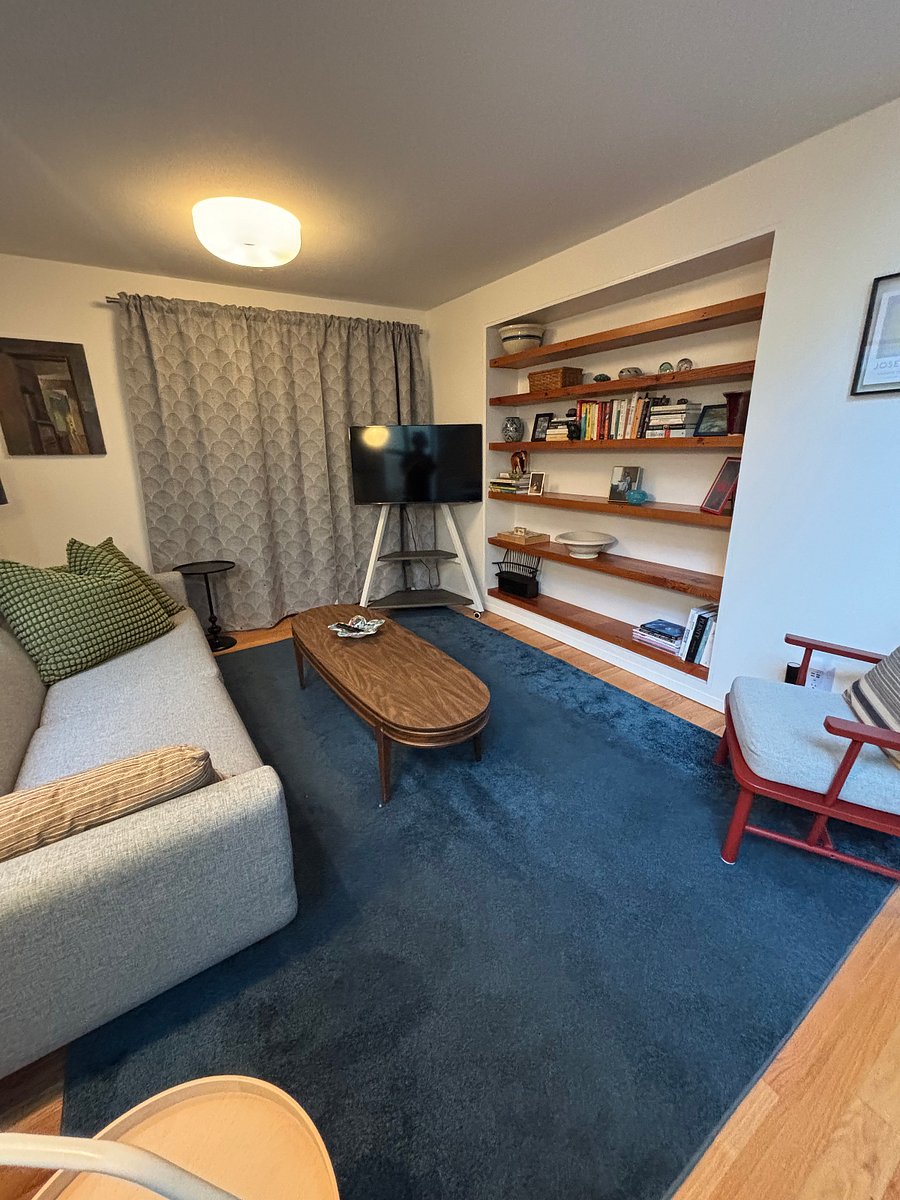 Movie time (smart TV on wheels) separate from fireplace seating area.