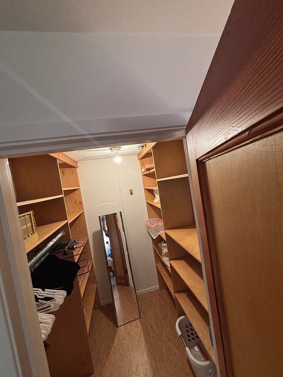 Walk in closet in primary east facing bedroom.