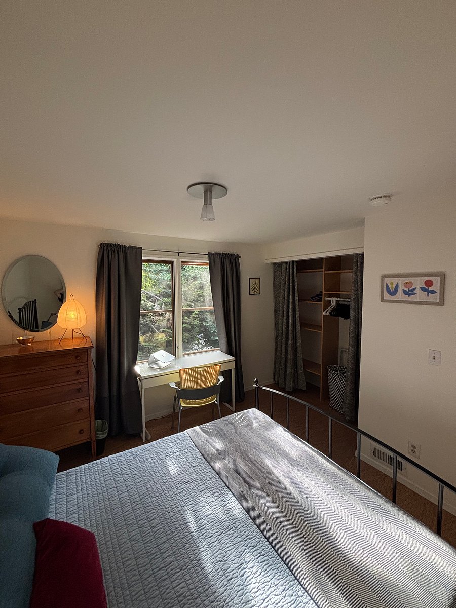 West facing bedroom, dresser, shelved & hanging closet, desk. Directly across from full bath.