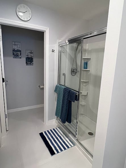 Walk-in shower with body wash provided. Separate room with commode.