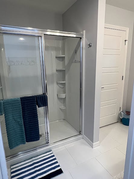 Walk-in shower with body wash provided. Adjacent Linen closet with extra towels, bed linens and blankets.