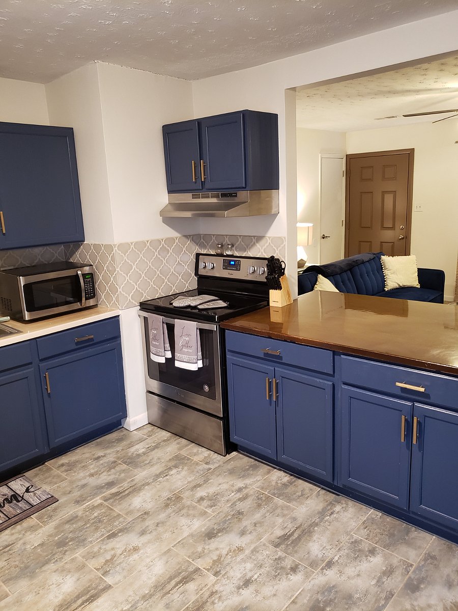 Kitchen has oven, microwave, dishwasher, garbage disposal and full size refrigerator