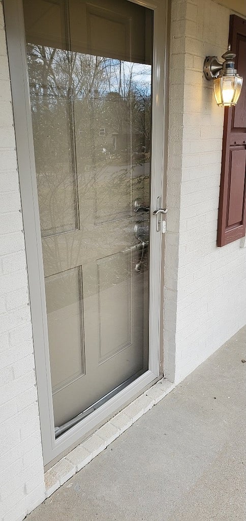 New storm door to allow daylight into the living room and extra storm protection