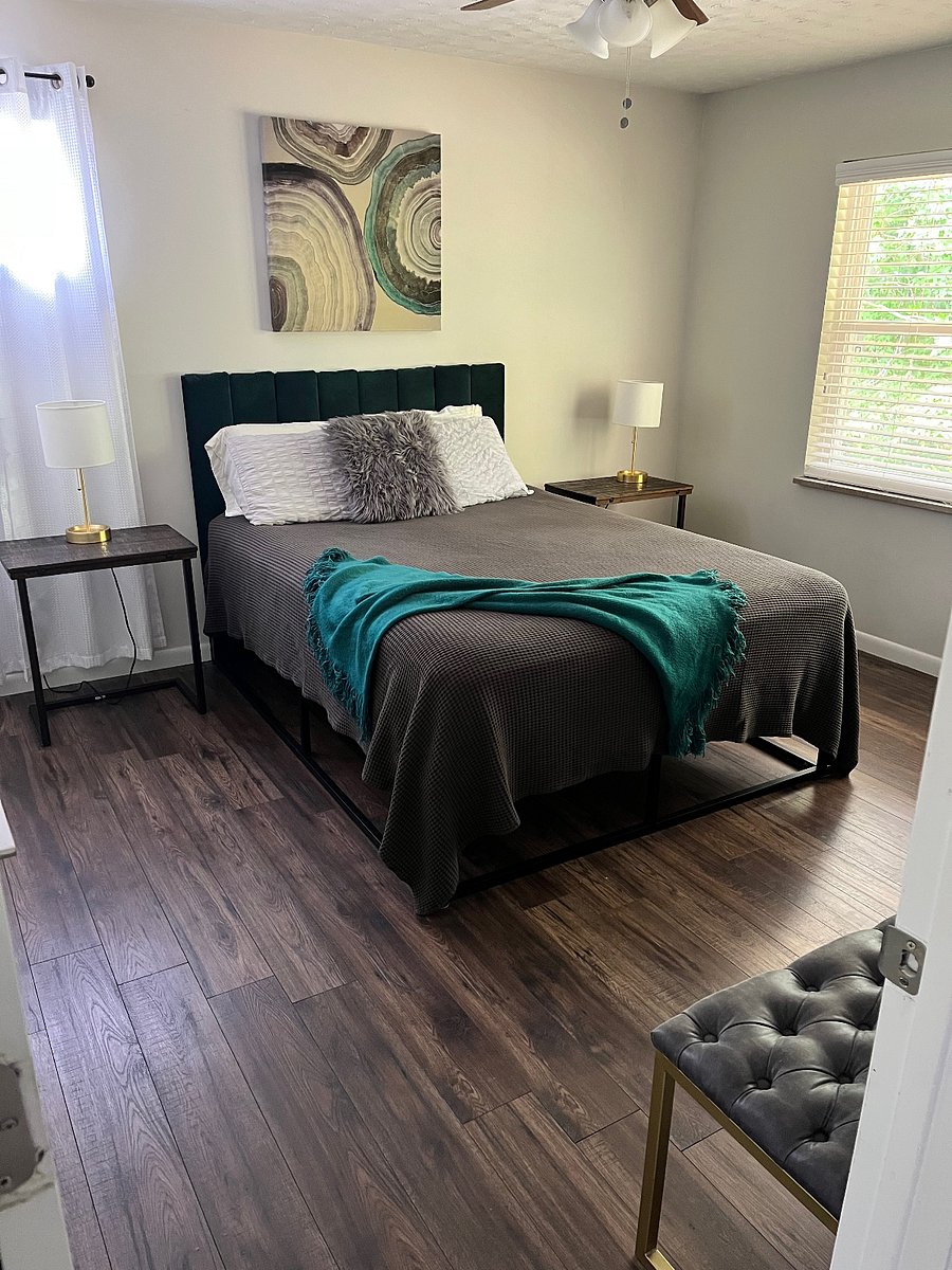 Queen bed with closet, dresser and storage shelves