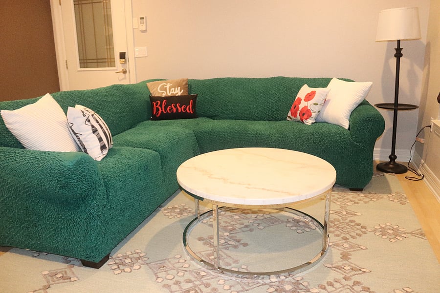 Really cozy sectional in the living area featuring a Gallery Furniture coffee table and a quality rug.  