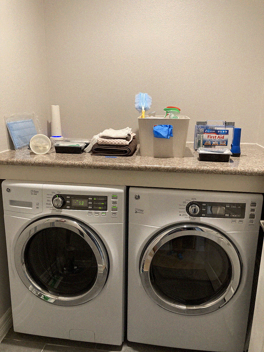 Large washer and dryer - plenty of space. Complementary Starter cleaning supplies, vacuum, broom & dust pan, and Swiffer, gloves included. Extra large ironing board and steam iron.