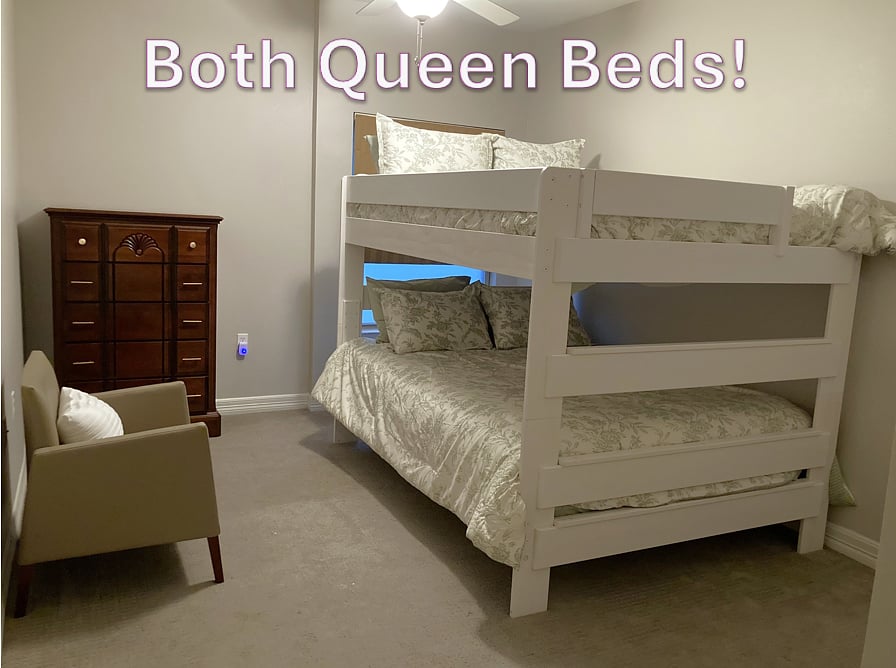 Bunk Bedroom has 2 Queen beds set up as bunk beds, 2 closets, a chest of drawers and chair. Another dresser can be added.