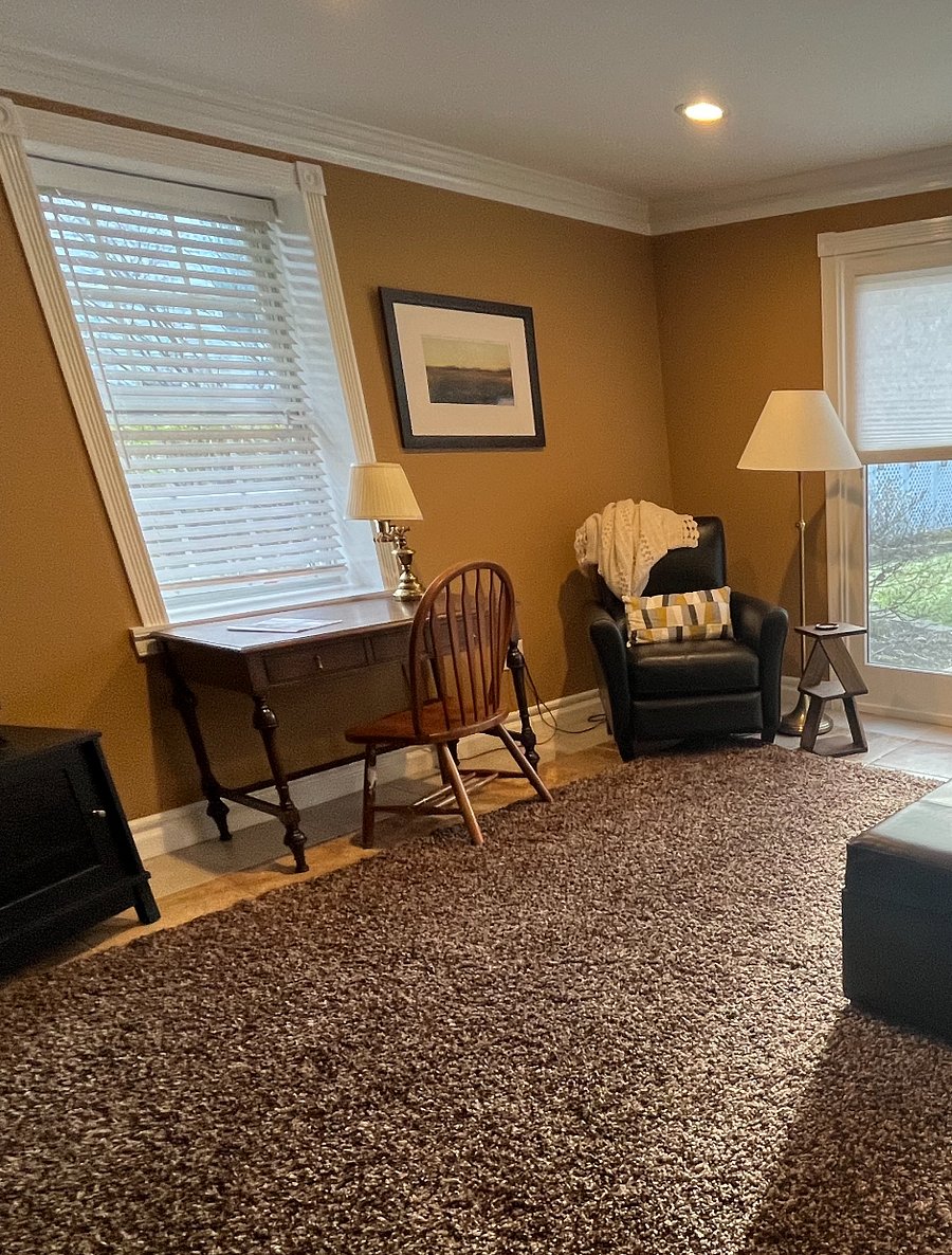 Working Desk Area with Recliner, Small Side Table and Floor Lamp