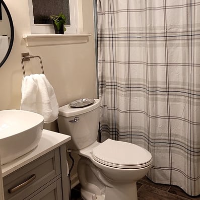 Updated bathroom with tub and shower.