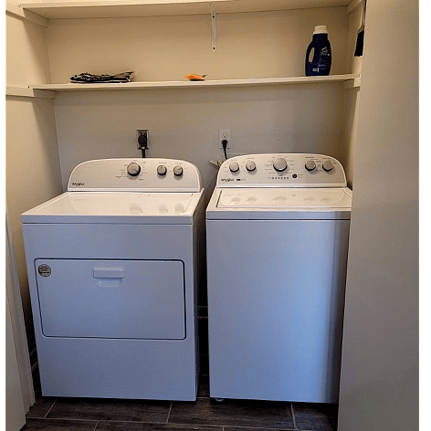 Full size washer and dryer closet inside unit.