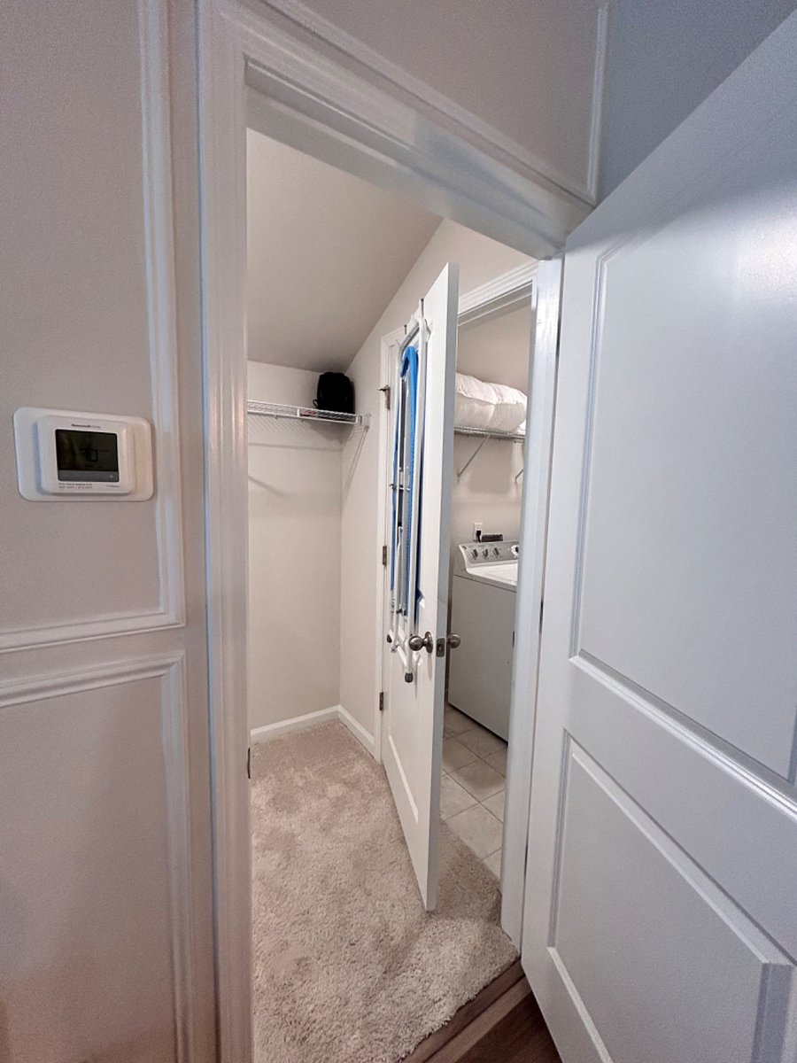 View of closet and laundry room from the bedroom area.