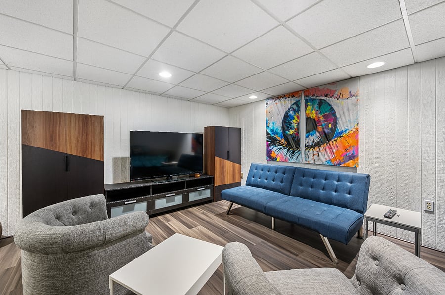 Unwind in our lower level retreat: A cozy haven that whispers relaxation and invites you to stay a little longer.  Queen size day bed with twin bed pullout underneath.