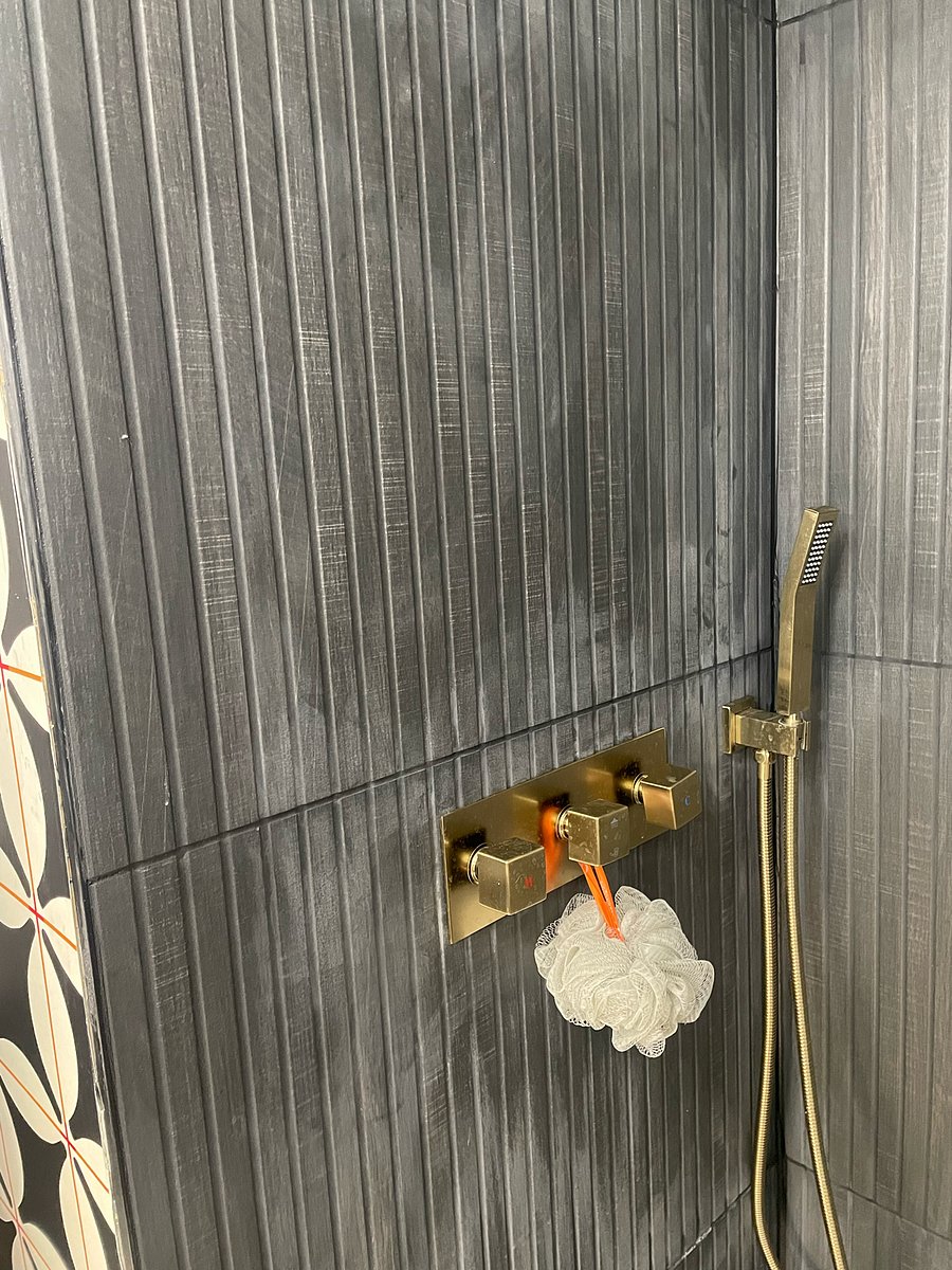 Immerse yourself in the epitome of relaxation. Our modern rain shower bathroom: where luxury meets the soothing rhythm of a gentle downpour.