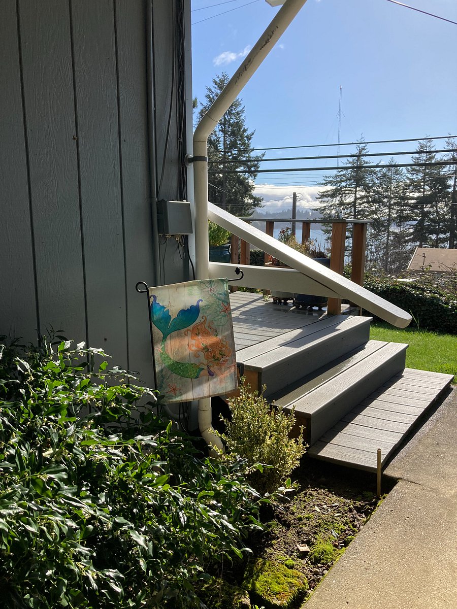 Stairs from carport to front deck and front door