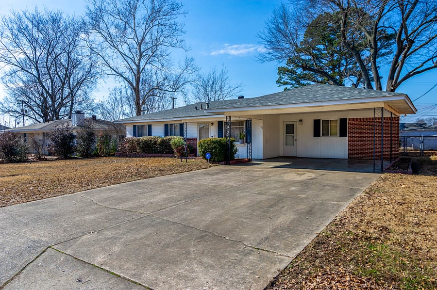 Front of the home: Double carport with 4 parking car space on the driveway, and an auto motion lights.
