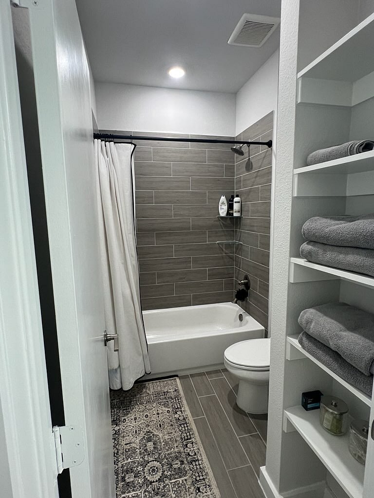 Shower and tub in second bedroom