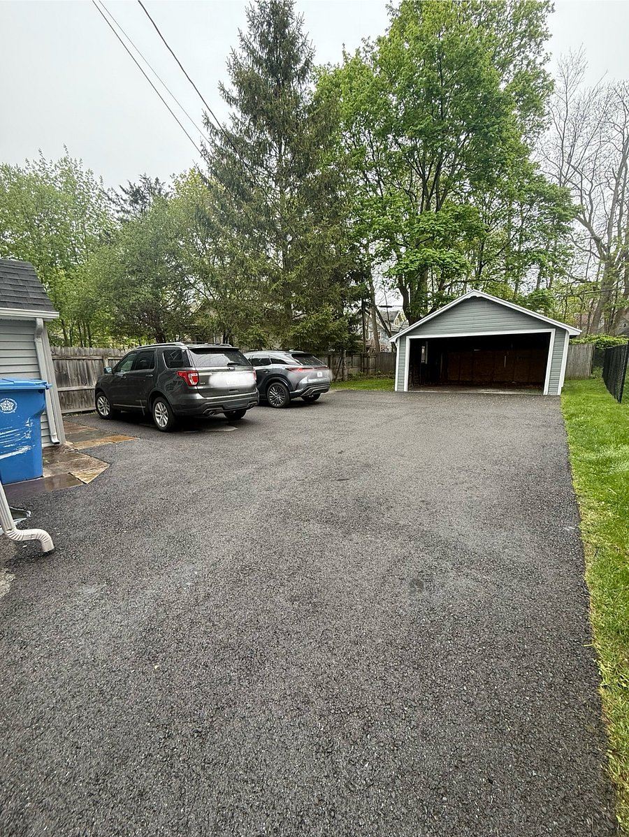 Rear Off-Street Parking (Free).  Shared rear pad fits 3 cars; garage not guaranteed. Please park considerately. Street parking also available.