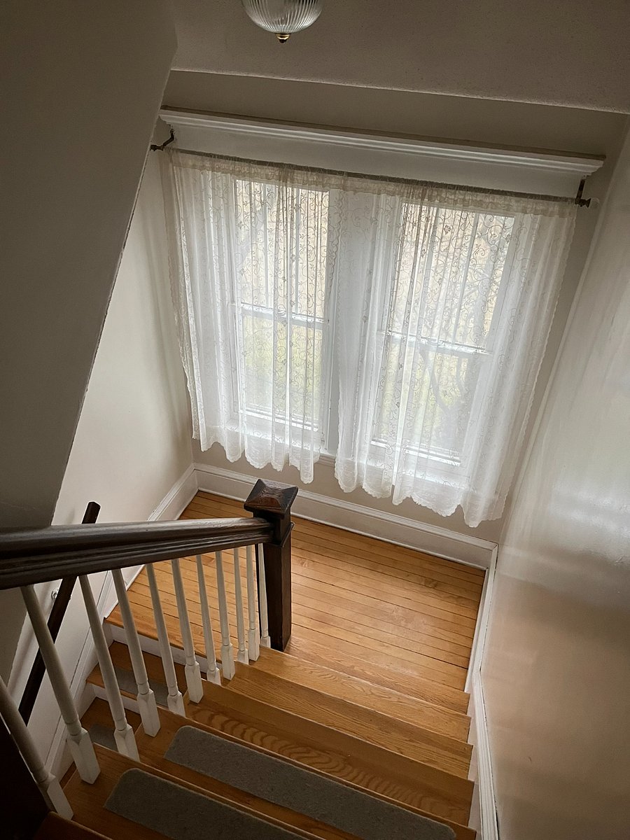 stairs to 2nd level of house, where bedroom and full bath are located